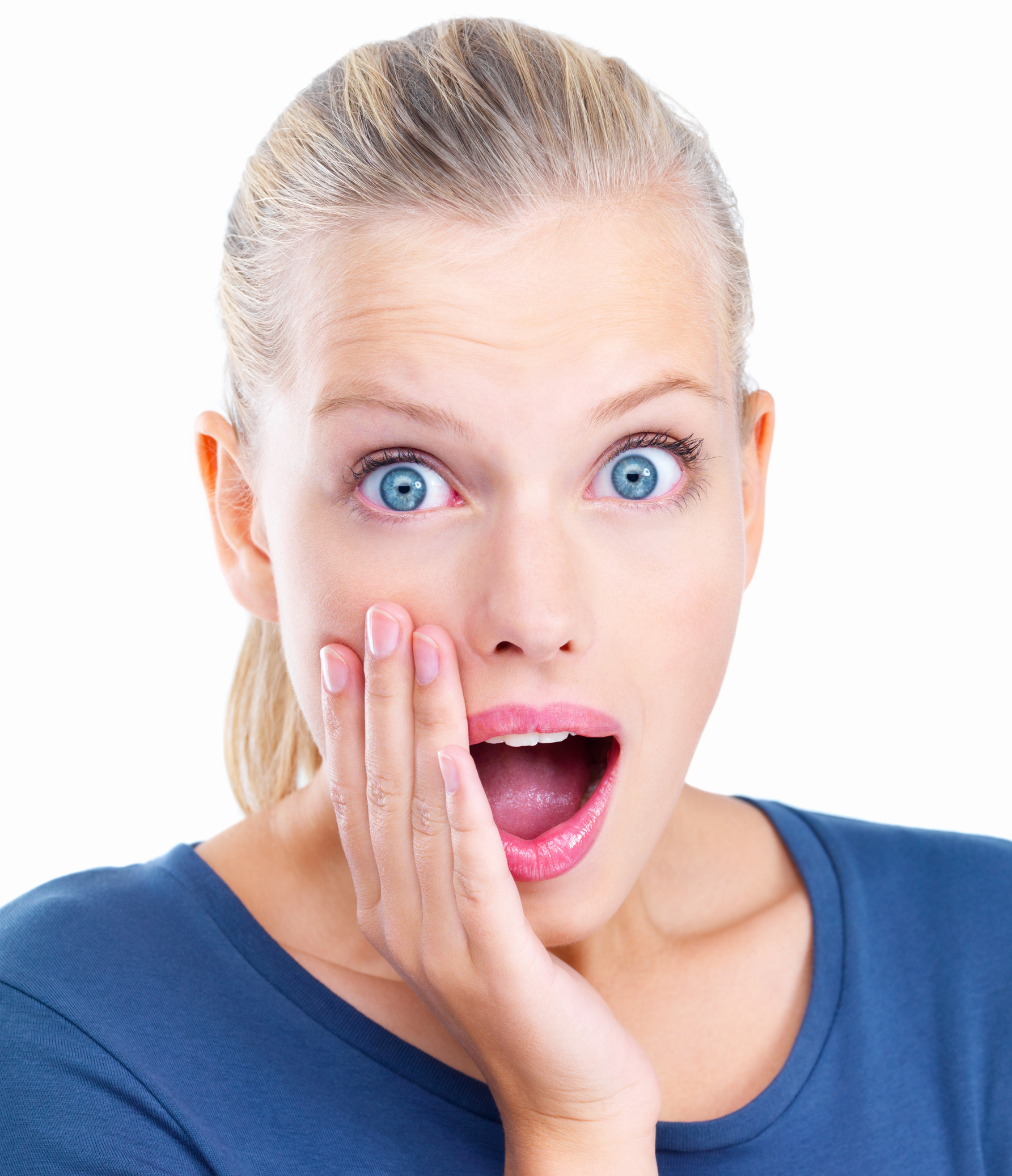 Isolated Portrait of a young woman looking surprised.